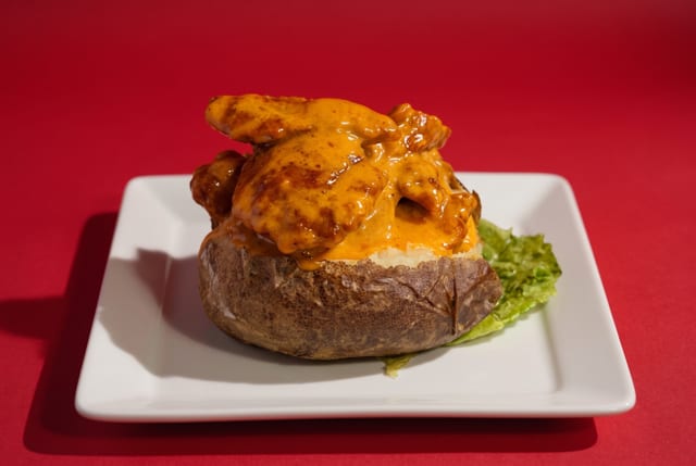 Kick'en Chicken Baked Potato.